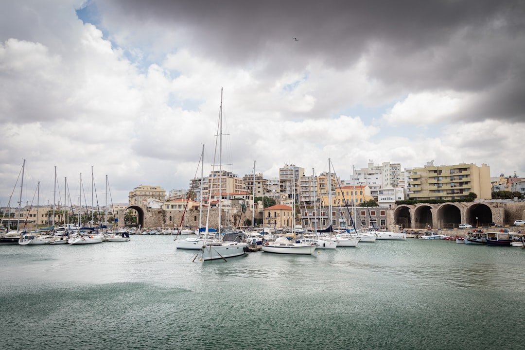 A harbor filled with lots of boats under a cloudy sky
