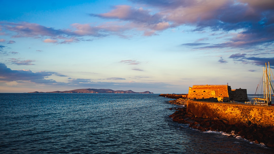 Coastal fortress and calm sea at sunset