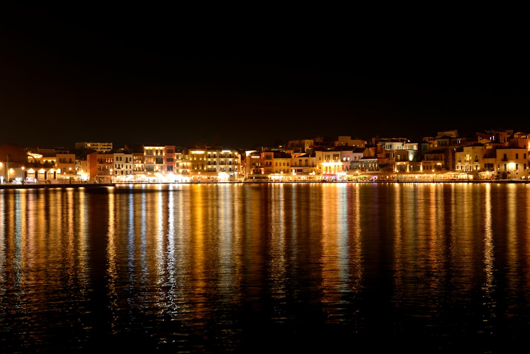 City lights reflecting on the dark water at night