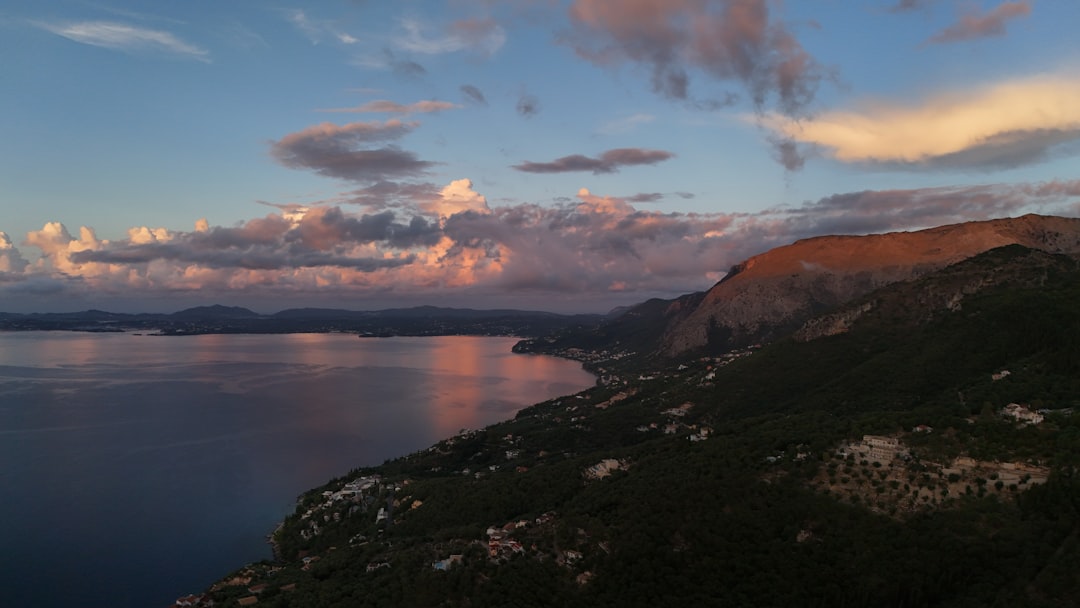 Coastal mountains bathed in the warm glow of sunset.