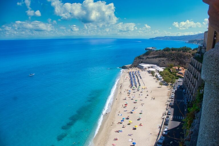 Beautiful beach with blue water and a sunny sky.