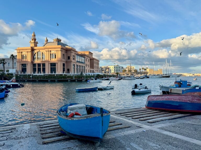 Boats docked near a historic building by the water