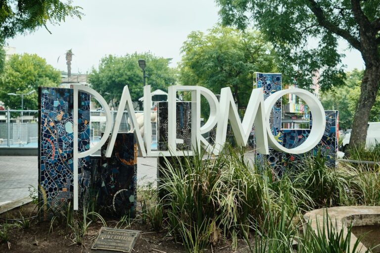 Large palermo sign with mosaic accents and greenery