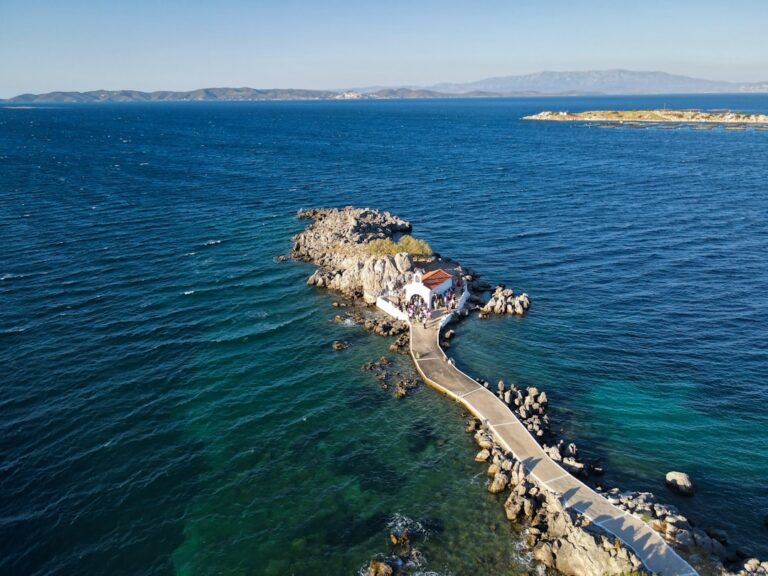 An aerial view of a pier in the middle of the ocean