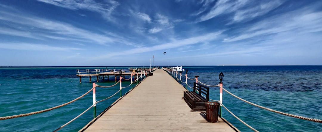 a pier with a bench on the end of it