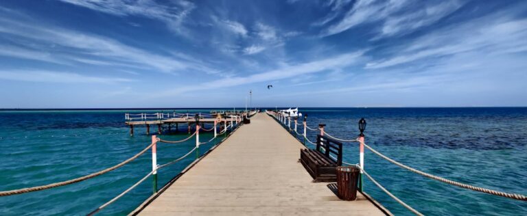 a pier with a bench on the end of it