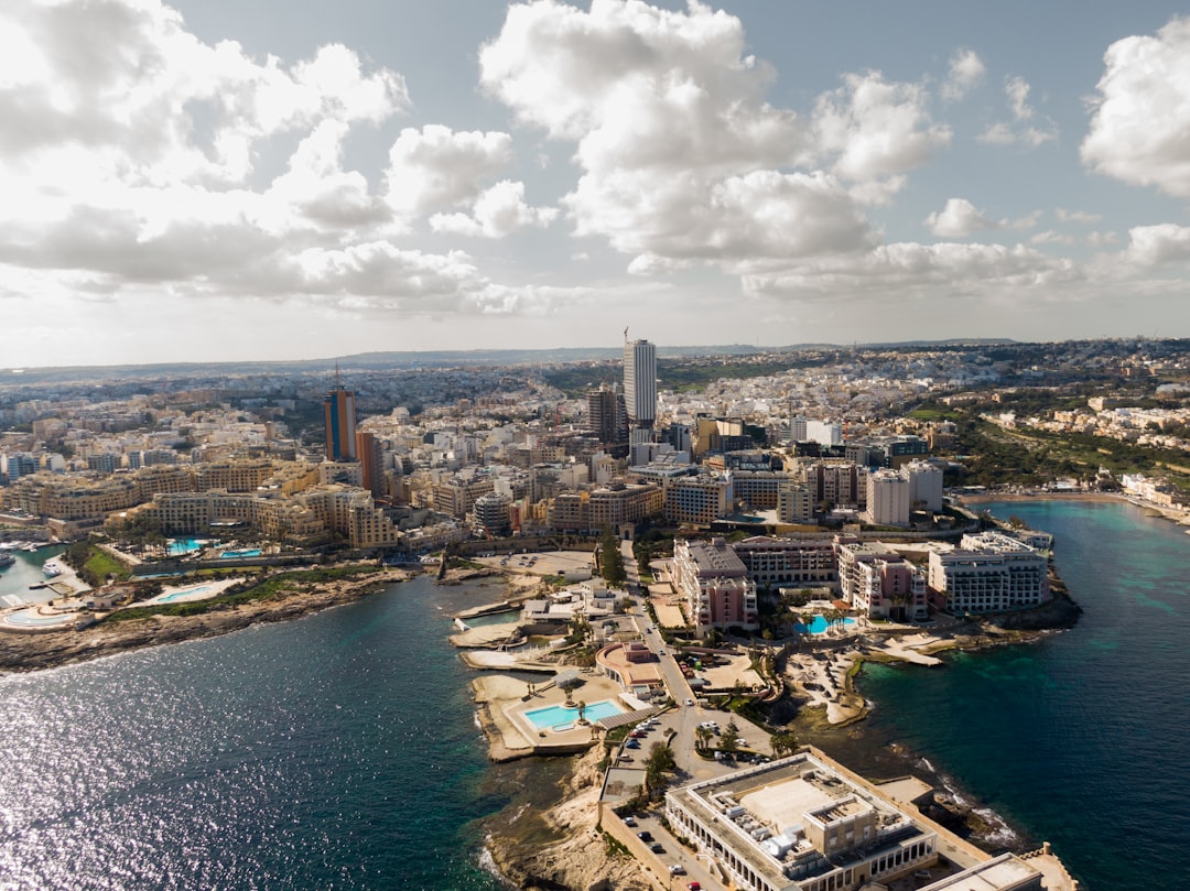 an aerial view of a city and a body of water
